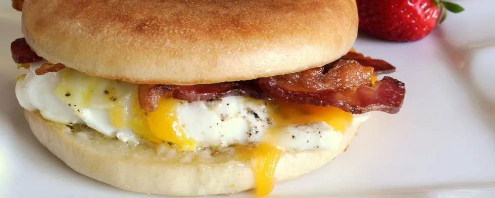 Bacon, egg and cheese breakfast sandwich on an English muffin